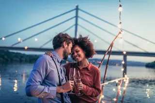 attractive young couple hugging on a boat