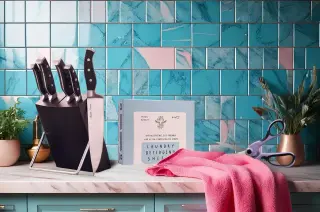 Picture of blue kitchen with pink towel thingy